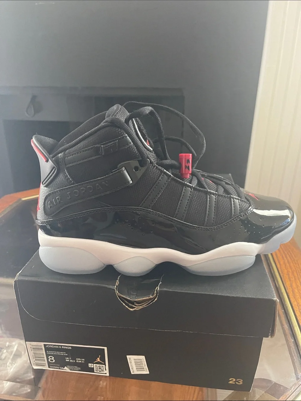 Jordan men’sHigh-Top Sneakers in Black with Red Accents